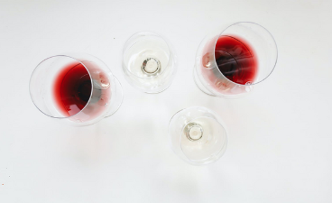 top down image of 2 glasses of red wine and 2 glasses of white wine